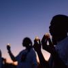 Students holding candles at the Mohammed Haitham memorial