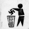 graffiti of person throwing away swastika
