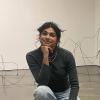 Image of student in front of art installation