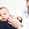 Baby in doctor's arms
