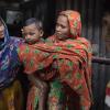 Girl, baby, woman and young man in Dhaka, Bangladesh