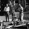 CU Rocket Project students Merle Reisbeck, left, and Russell Nidey look on as a colleague works on a biaxial pointing control. Photo courtesy CU/LASP.