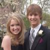 Caitlin Epple and Kyle Metcalf pose before going to their high-school prom.