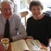 Ken and Ruth Wright look over Ruth's copy of the complete works of Shakespeare.