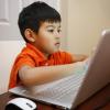 Child in front of a laptop