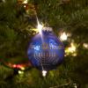 An ornament on a Christmas tree reads, "Happy Hanukkah."