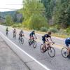 An image of a group of bike riders riding uphill on the course of the Buffalo Bicycle Classic