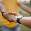 Two people holding hands