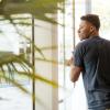 A Black male walking through a door