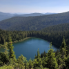Mountain lake surrounded by evergreen forest
