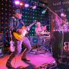 Murat Iyigun playing guitar onstage