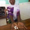 In 2006, after testing positive for HIV and seeing her CD4 count drop to 159 (from a normal level of about 1,000), Penina Petro started on the road to better health with the help of the medications she received from Sekotoure Hospital, Tanzania, under Global HIV/AIDS Program funding. In 2001-02, CU Professor Keith Maskus helped launch a similar program while serving as lead economist in the Development Research Group at the World Bank. Photo by U.S. Health Resources and Services Adminitration.