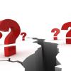 Questions marks around a chasm