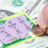 Scratching a lottery ticket with a U.S. penny