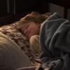 A young study participant tries to get some sleep. New research shows that even dim light exposure in the hour before bedtime can disrupt slumber in young children.