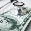 stethoscope on hundred dollar bill