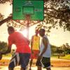 Men playing outdoor basketball in Tanzania