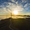 Stock photograph of a wind turbine at sunset