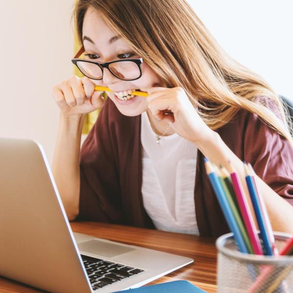 student nervously biting a pencil
