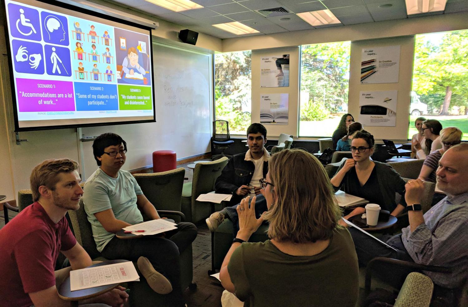 Participants work in small groups during a workshop on Universal Design for Learning