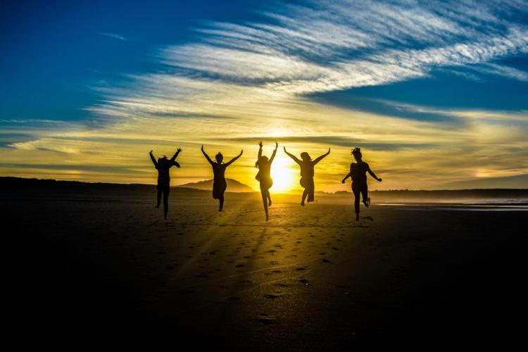 Silhouette of young people celebrating