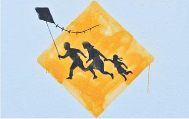 Bansky painting of family crossing road sign