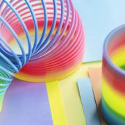 Photo of a rainbow colored slinky spring toy