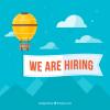 We Are Hiring Sign attached to hot-air balloon