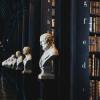 library racks with sculptures on stands