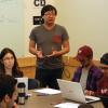 Student Technology Consultants Nicola Cave and Austin Chau provide a demonstration in class to students.