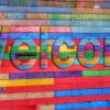 wooden backdrop with rainbow colored boards spells out the word 'welcome'