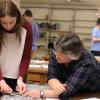 Dr. Nicole Jobin working with a student on a hands on project