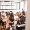 friends gather around a table to converse and have drinks