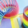 Photo of a rainbow colored slinky spring toy