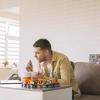 Father working from home with young child