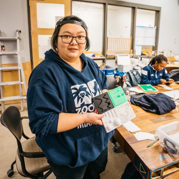 ruhan yang holding a 3d printed cube