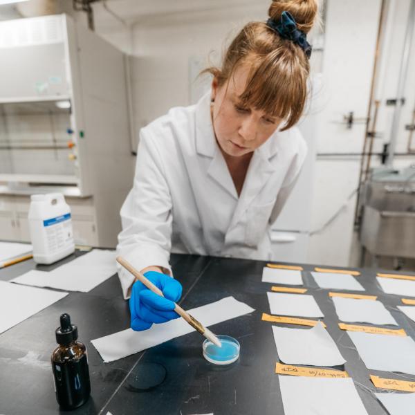 Fiona Bell applies nanocoating to fabric sample