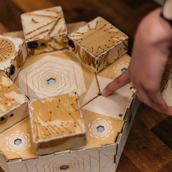 Photo of capstone project with capacitive touch wooden boxes