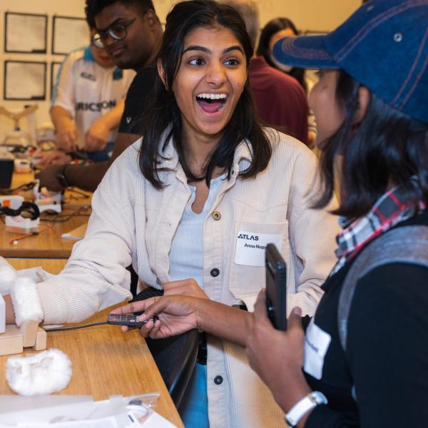 grad students interacting with think lab technology projects