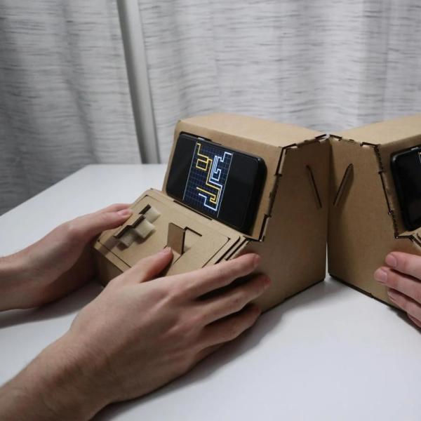two miniature game arcades made of cardboard