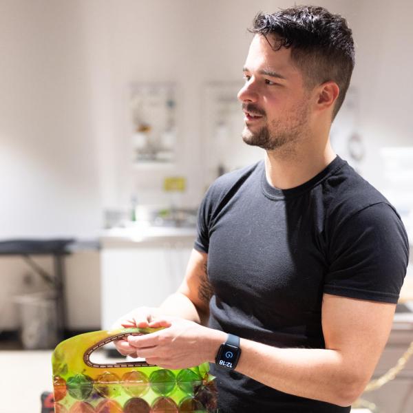 man holding bioplastic purse