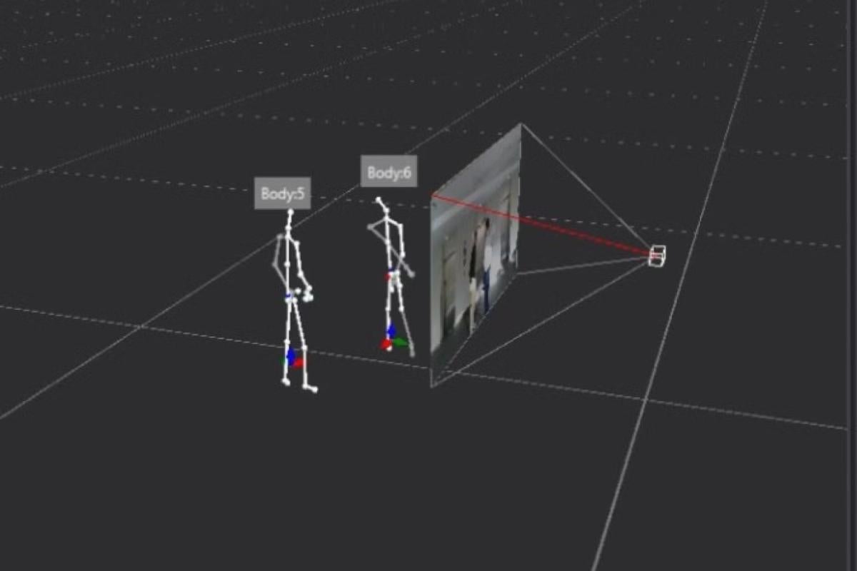 Two 3d modeled skeletal figures standing on a gray plane. A screen is in front of them.