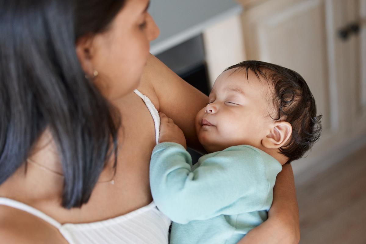 Woman holding a baby in her arms
