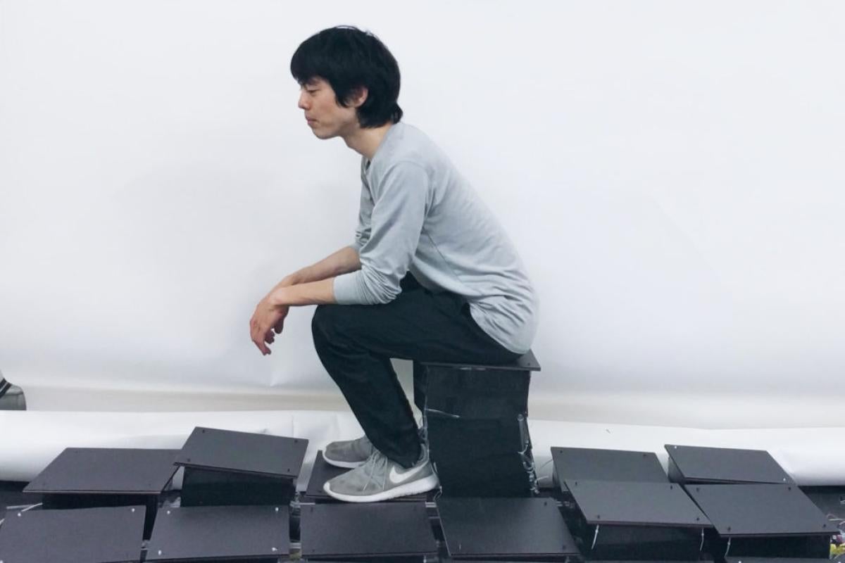 Ryo Suzuki sits on a LiftTile.