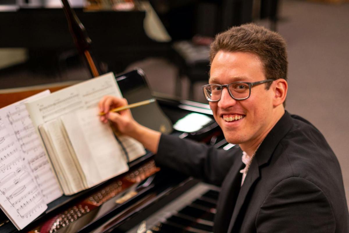 ben sitting at a piano