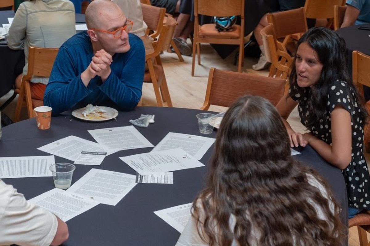 Students and mentors discussing key issues around a table
