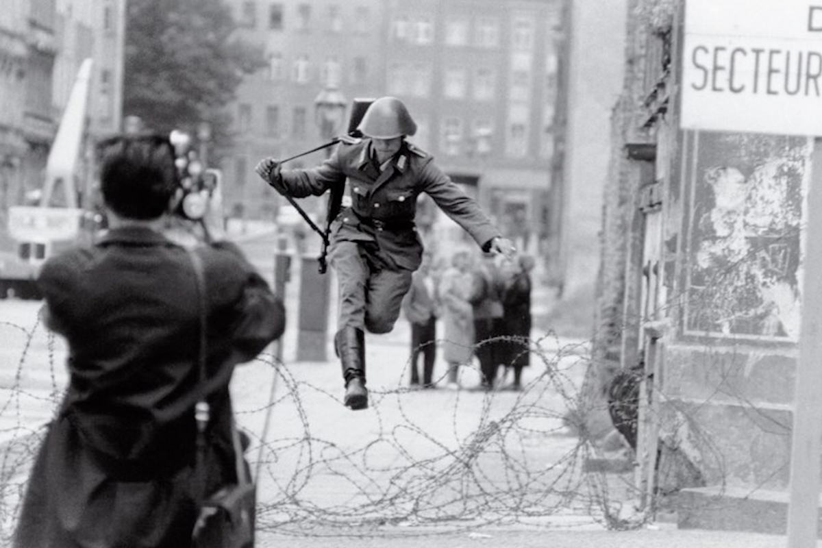 Soldier jumping over razor wire