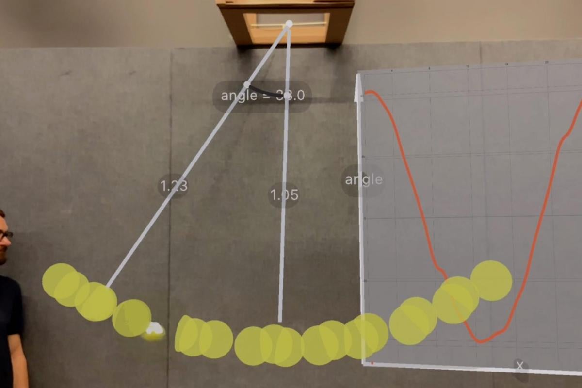 Using RealitySketch on an iPad to visualize the motion of a pendulum with a stroboscopic effect.