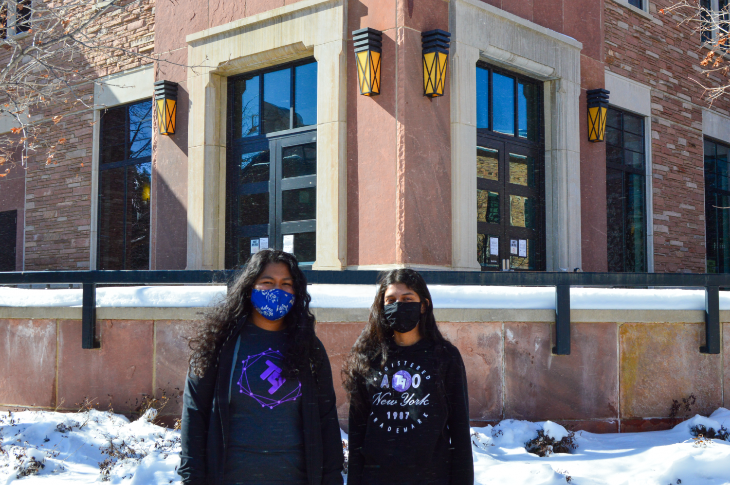 Neha and Oceane in front of the ATLAS building