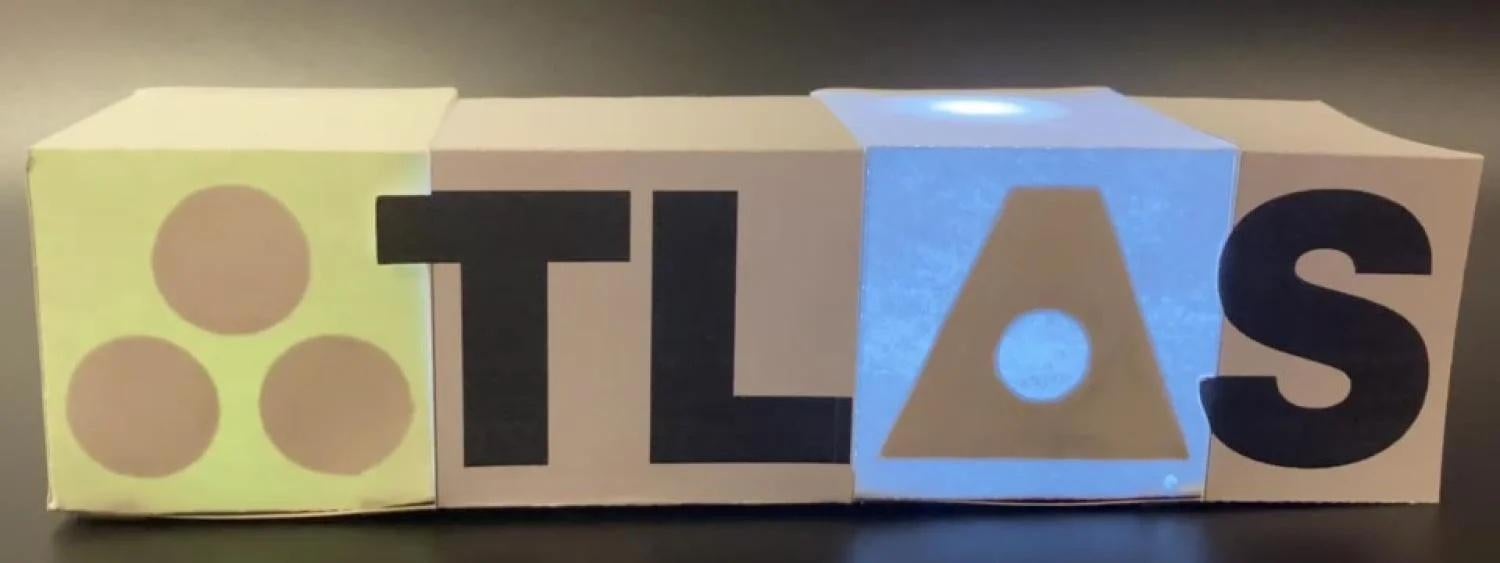 A light up paper box that says "ATLAS."